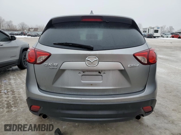 2015 Mazda CX-5 Sport with VIN JM3KE4BEXF0499688, listed as a Copart auction lot 88988095 with 258,460 mi miles and Salvage title. Bid and sale history available at DreamBid. Image 6.