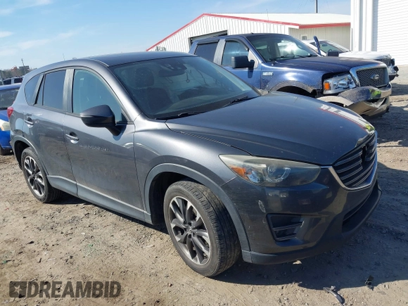 2016 Mazda CX-5 Grand Touring with VIN JM3KE4DY8G0823567, listed as a IAAI auction lot 41784384 with 143,836 mi miles and . Bid and sale history available at carsss.com. Image 1.