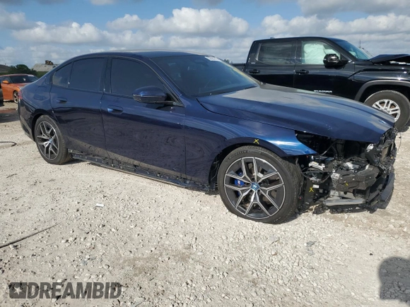 2024 BMW i5 eDrive40 with VIN WBY33FK09RCR50159, listed as a Copart auction lot 55520615 with 12,564 mi miles and Salvage title. Bid and sale history available at DreamBid. Image 4.