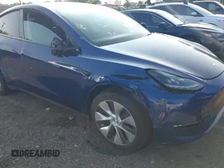 2023 Tesla Model Y Long Range with VIN 7SAYGDEE0PF671726, listed as a IAAI auction lot 42393616 with Not provided miles and . Bid and sale history available at DreamBid. Image 6.