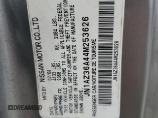 2004 Nissan 350Z Touring z VIN JN1AZ36A44M253626, wystawiony jako Copart lot #79089504 z przebiegiem 138 345 mil mil oraz Szkoda całkowita • Salvage title. Historia ofert i sprzedaży dostępna na DreamBid. Obrazek 13.