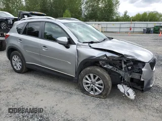 2014 Mazda CX-5 Touring z VIN JM3KE4CY0E0407169, wystawiony jako Copart lot #57877215 z przebiegiem 168 277 mil mil oraz Szkoda całkowita • Salvage title. Historia ofert i sprzedaży dostępna na DreamBid. Obrazek 4.