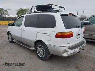 1999 Toyota Sienna LE with VIN 4T3ZF13C2XU105212, listed as a IAAI auction lot 42066557 with 153,659 mi miles. Bid and sale history available at carsss.com. Image 3.