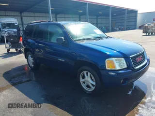 2004 GMC Envoy SLE with VIN 1GKDT13S242391968, listed as a IAAI auction lot 42079420 with 234,611 mi miles. Bid and sale history available at carsss.com. Image 1.