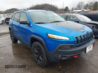 2018 Jeep Cherokee Trailhawk with VIN 1C4PJMBX3JD512813, listed as a IAAI auction lot 41457312 with 125,644 mi miles. Bid and sale history available at carsss.com. Image 1.