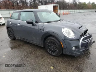 2014 MINI Hardtop S with VIN WMWXM7C54ET985344, listed as a Copart auction lot 52012465 with 87,017 mi miles and Salvage title. Bid and sale history available at DreamBid. Image 4.