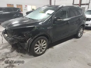 2017 Ford Escape Titanium with VIN 1FMCU9J9XHUB51401, listed as a IAAI auction lot 41025642 with 77,908 mi miles. Bid and sale history available at carsss.com. Image 2.