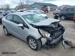 2014 Kia Rio EX with VIN KNADN4A36E6338670, listed as a IAAI auction lot 42035501 with 166,561 mi miles. Bid and sale history available at carsss.com. Image 1.