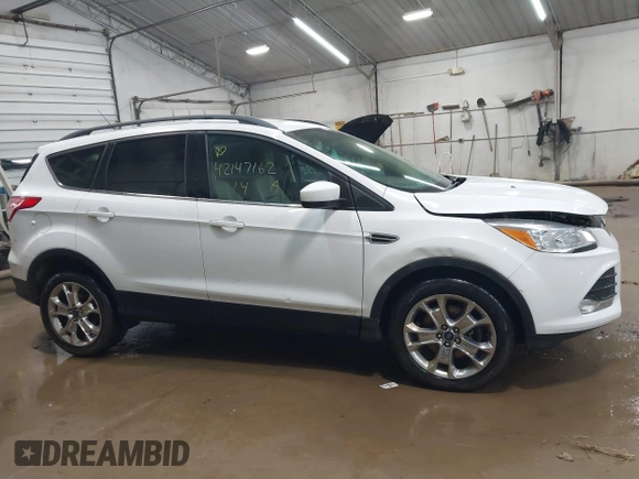 2014 Ford Escape SE with VIN 1FMCU9G99EUC15477, listed as a IAAI auction lot 42147162 with 98,886 mi miles and . Bid and sale history available at DreamBid. Image 13.