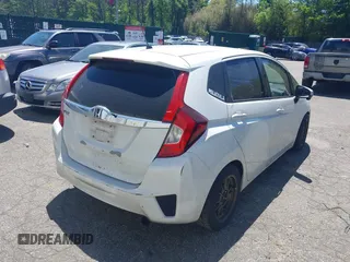 2015 Honda Fit EX z VIN 3HGGK5G84FM733886, wystawiony jako IAAI lot #42298129 z przebiegiem 84 383 mil mil oraz . Historia ofert i sprzedaży dostępna na DreamBid. Obrazek 4.