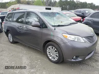 2014 Toyota Sienna XLE z VIN 5TDYK3DC2ES420737, wystawiony jako IAAI lot #41935750 z przebiegiem 184 978 mil mil oraz . Historia ofert i sprzedaży dostępna na DreamBid. Obrazek 1.