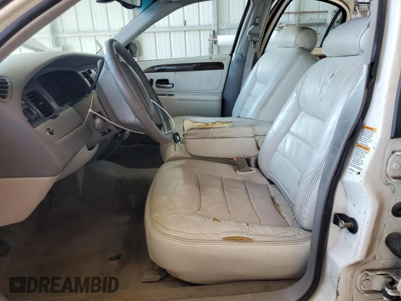 1999 Lincoln Town Car Executive with VIN 1LNHM81W2XY658371, listed as a Copart auction lot 60249045 with 191,266 mi miles and Salvage title. Bid and sale history available at DreamBid. Image 7.