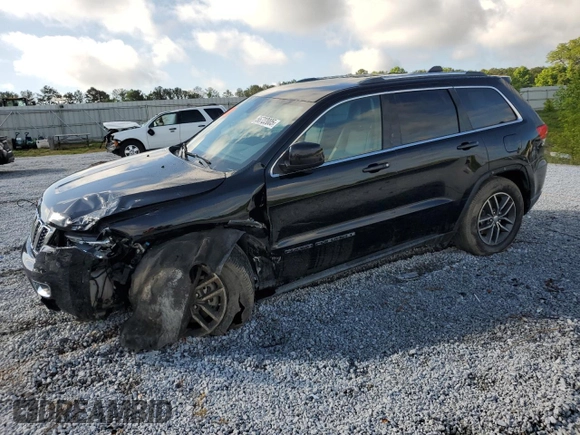 2018 Jeep Grand Cherokee Laredo E with VIN 1C4RJEAGXJC246874, listed as a Copart auction lot 56722005 with 101,493 mi miles and Salvage title. Bid and sale history available at DreamBid. Image 1.