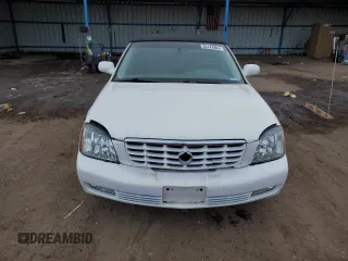 2004 Cadillac DeVille DTS z VIN 1G6KF57944U122824, wystawiony jako Copart lot #86147994 z przebiegiem 118 156 mil mil oraz Szkody całkowita. Historia ofert i sprzedaży dostępna na DreamBid. Obrazek 5.