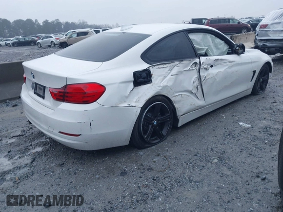2014 BMW 4 Series 428i with VIN WBA3N7C52EF718794, listed as a IAAI auction lot 41416632 with 179,681 mi miles and . Bid and sale history available at carsss.com. Image 4.