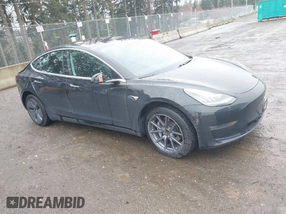 2019 Tesla Model 3 Mid Range with VIN 5YJ3E1EAXKF296378, listed as a IAAI auction lot 41739616 with 77,100 mi miles and . Bid and sale history available at DreamBid. Image 1.