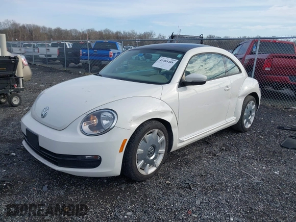 2014 Volkswagen Beetle 2.5L w/Sun with VIN 3VWJP7AT8EM611560, listed as a IAAI auction lot 41488488 with 140,798 mi miles and . Bid and sale history available at DreamBid. Image 18.
