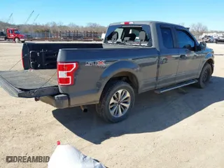 2018 Ford F-150 XL with VIN 1FTEX1EP7JFB50666, listed as a IAAI auction lot 41693673 with 149,570 mi miles. Bid and sale history available at carsss.com. Image 4.