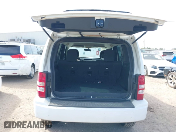 2012 Jeep Liberty Sport with VIN 1C4PJLAK0CW116653, listed as a IAAI auction lot 41818122 with 111,036 mi miles and . Bid and sale history available at DreamBid. Image 12.