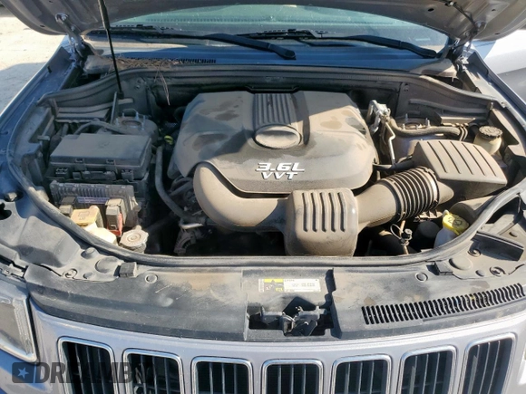 2014 Jeep Grand Cherokee Laredo with VIN 1C4RJEAG4EC182773, listed as a Copart auction lot 54085255 with 138,775 mi miles and Salvage Title. Bid and sale history available at DreamBid. Image 12.