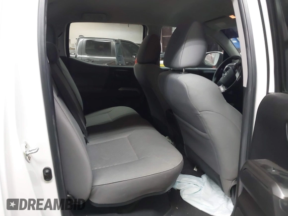 2023 Toyota Tacoma SR5 z VIN 3TYAZ5CN9PT030723, wystawiony jako IAAI lot #41607535 z przebiegiem 40 215 mil mil oraz . Historia ofert i sprzedaży dostępna na DreamBid. Obrazek 8.