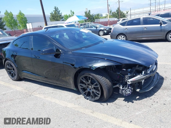 2022 Tesla Model S with VIN 5YJSA1E51NF464231, listed as a IAAI auction lot 42077838 with 53,290 mi miles and . Bid and sale history available at DreamBid. Image 1.
