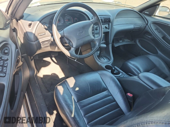 2000 Ford Mustang GT with VIN 1FAFP45X7YF265824, listed as a Copart auction lot 65204825 with 69,117 mi miles and Salvage title. Bid and sale history available at DreamBid. Image 8.