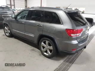 2013 Jeep Grand Cherokee Overland with VIN 1C4RJFCT9DC524605, listed as a IAAI auction lot 42016103 with 215,352 mi miles. Bid and sale history available at carsss.com. Image 3.