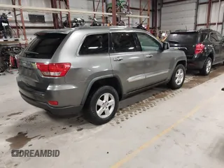 2011 Jeep Grand Cherokee Laredo with VIN 1J4RR4GG3BC623048, listed as a IAAI auction lot 42163452 with 192,241 mi miles and . Bid and sale history available at DreamBid. Image 4.
