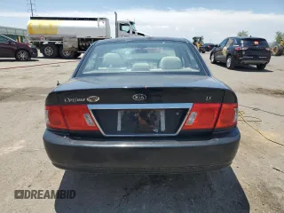 2006 Kia Optima LX z VIN KNAGD126865452524, wystawiony jako Copart lot #59813015 z przebiegiem 130 090 mil mil oraz Szkoda całkowita • Salvage title. Historia ofert i sprzedaży dostępna na DreamBid. Obrazek 6.
