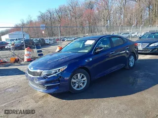 2018 Kia Optima LX with VIN 5XXGT4L33JG191559, listed as a IAAI auction lot 41875793 with 152,479 mi miles. Bid and sale history available at carsss.com. Image 2.