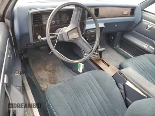 1984 Chevrolet El Camino z VIN 1GCCW80H7ER173291, wystawiony jako Copart lot #76606244 z przebiegiem Nie podano mil oraz Szkoda całkowita • Salvage title. Historia ofert i sprzedaży dostępna na DreamBid. Obrazek 8.