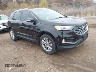 2020 Ford Edge Titanium z VIN 2FMPK4K93LBB35550, wystawiony jako IAAI lot #41959722 z przebiegiem 96 999 mil mil oraz . Historia ofert i sprzedaży dostępna na DreamBid. Obrazek 1.