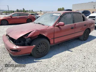1997 Toyota Corolla DX with VIN 1NXBB02EXVZ510072, listed as a Copart auction lot 65743465 with 241,726 mi miles and Salvage title. Bid and sale history available at DreamBid. Image 1.
