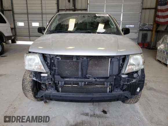 2015 Nissan Frontier SV with VIN 1N6BD0CT1FN713999, listed as a Copart auction lot 62053944 with 104,667 mi miles and Salvage title. Bid and sale history available at DreamBid. Image 5.