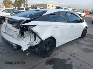 2021 Toyota Prius L Eco z VIN JTDKAMFU9M3131228, wystawiony jako IAAI lot #41257117 z przebiegiem 72 840 mil mil oraz . Historia ofert i sprzedaży dostępna na DreamBid. Obrazek 4.