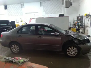 2004 Toyota Corolla CE with VIN 1NXBR32E14Z204650, listed as a IAAI auction lot 41710452 with 168,099 mi miles. Bid and sale history available at carsss.com. Image 13.