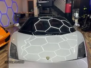 2013 Lamborghini Gallardo z VIN ZHWGU6BZ7DLA12511, wystawiony jako Copart lot #85780924 z przebiegiem 35 386 mil mil oraz Szkody całkowita. Historia ofert i sprzedaży dostępna na DreamBid. Obrazek 5.