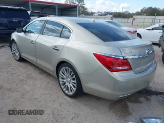 2014 Buick LaCrosse Premium II with VIN 1G4GF5G32EF129559, listed as a IAAI auction lot 41780260 with 120,487 mi miles and . Bid and sale history available at DreamBid. Image 3.