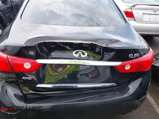 2015 Infiniti Q50 z VIN JN1BV7AR6FM412573, wystawiony jako IAAI lot #41796802 z przebiegiem 136 410 mil mil oraz . Historia ofert i sprzedaży dostępna na DreamBid. Obrazek 16.