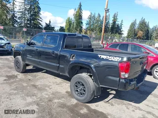 2016 Toyota Tacoma SR5 with VIN 5TFDZ5BN7GX001869, listed as a IAAI auction lot 40610002 with 184,380 mi miles. Bid and sale history available at carsss.com. Image 3.