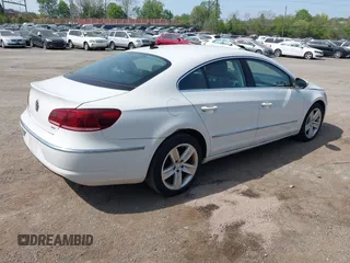 2013 Volkswagen CC Sport with VIN WVWBP7AN0DE523261, listed as a IAAI auction lot 42106039 with 136,105 mi miles. Bid and sale history available at carsss.com. Image 4.
