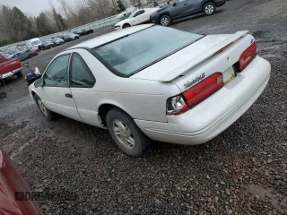 1997 Ford Thunderbird LX with VIN 1FALP62W2VH154138, listed as a Copart auction lot 46281235 with 145,738 mi miles and Clean Title. Bid and sale history available at DreamBid. Image 2.