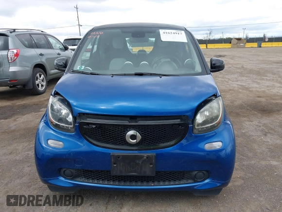 2016 Smart fortwo Passion z VIN WMEFJ5DA8GK059871, wystawiony jako IAAI lot #41624917 z przebiegiem 90 906 mil mil oraz . Historia ofert i sprzedaży dostępna na DreamBid. Obrazek 12.