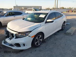 2019 Honda Civic LX with VIN 19XFC2F61KE014007, listed as a IAAI auction lot 41795070 with 64,259 mi miles and . Bid and sale history available at DreamBid. Image 17.