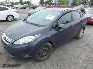 2013 Ford Fiesta SE with VIN 3FADP4BJ0DM199277, listed as a IAAI auction lot 42047833 with 142,739 mi miles. Bid and sale history available at carsss.com. Image 2.