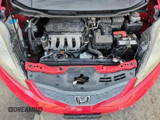 2009 Honda Fit Sport z VIN JHMGE88479S055924, wystawiony jako Copart lot #67186495 z przebiegiem 65 984 mil mil oraz Szkoda całkowita • Salvage title. Historia ofert i sprzedaży dostępna na DreamBid. Obrazek 11.