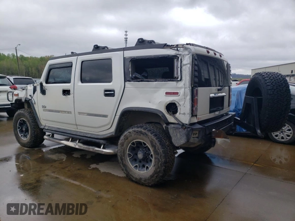 2003 Hummer H2 with VIN 5GRGN23U43H128269, listed as a Copart auction lot 47992444 with 153,360 mi miles and Salvage Title. Bid and sale history available at carsss.com. Image 2.