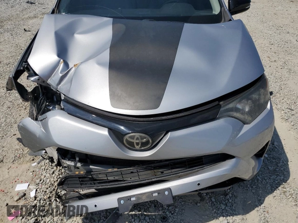 2018 Toyota RAV4 XLE with VIN 2T3WFREVXJW427748, listed as a Copart auction lot 61833055 with 104,057 mi miles and Salvage title. Bid and sale history available at DreamBid. Image 12.