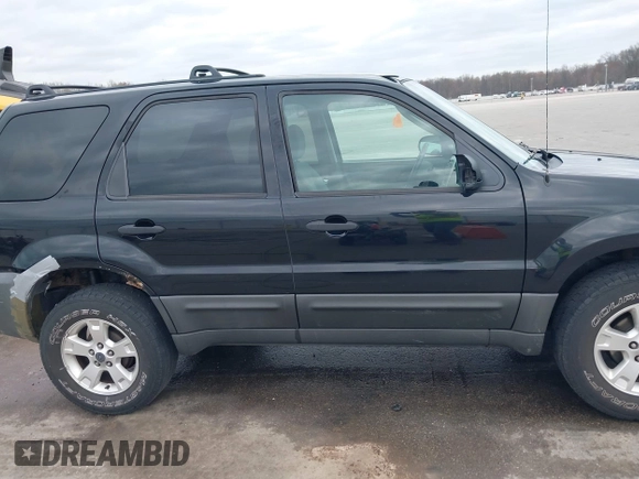 2005 Ford Escape XLT with VIN 1FMCU03135KB37656, listed as a IAAI auction lot 41908207 with 191,899 mi miles. Bid and sale history available at carsss.com. Image 13.